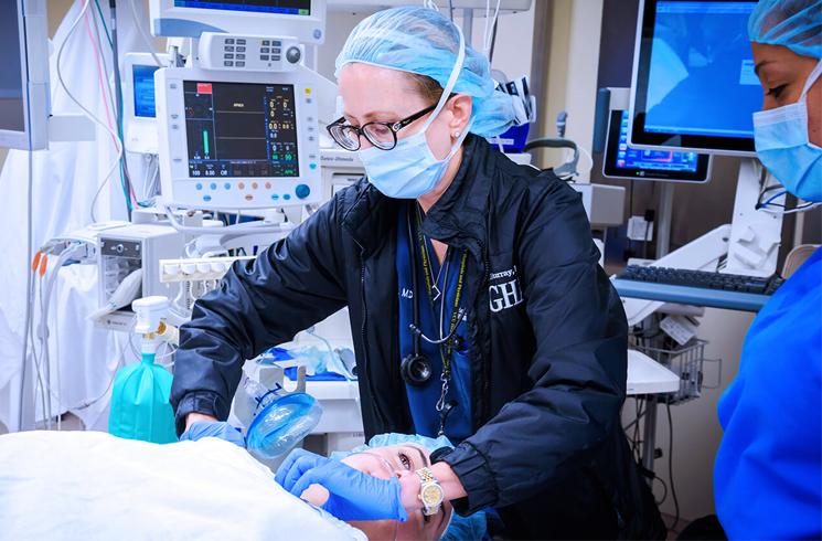 Anesthesiologist working with patient 